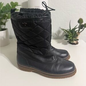 Coach Samara black
quilted cold-weather boot.